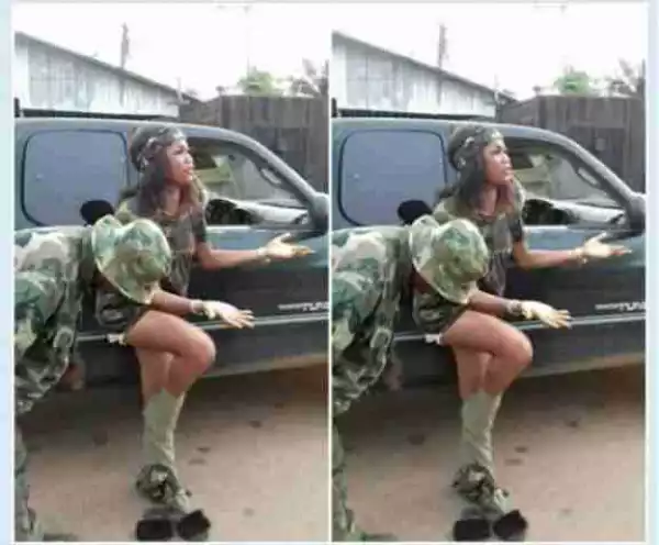 Soldier Forces Lady To Pull Off Camouflage Clothing She Wore (Photo)